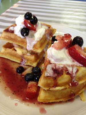 Berry Waffle Blintz .... vanilla malt Belgium Waffle layered 
with a creamy blintz filling with a strawberry & blueberry 
compote and fresh made whipped cream