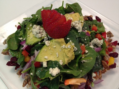 Spinach salad: peppers, red onion, avocado, craisins, 
candied pecans, bleu cheese crumbles with a strawberry 
vinaigrette