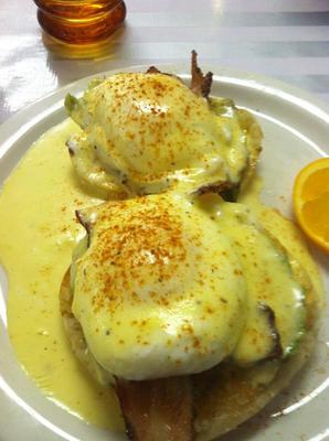 Timi's Benny ... our version of Eggs Benedict.  Handbeaten 
from scratch Hollandaise that makes this dish! English 
Muffin topped with Maple Pepper bacon and avocado, a 
poached egg then blanketed with the sauce of love, 
Hollandaise.  